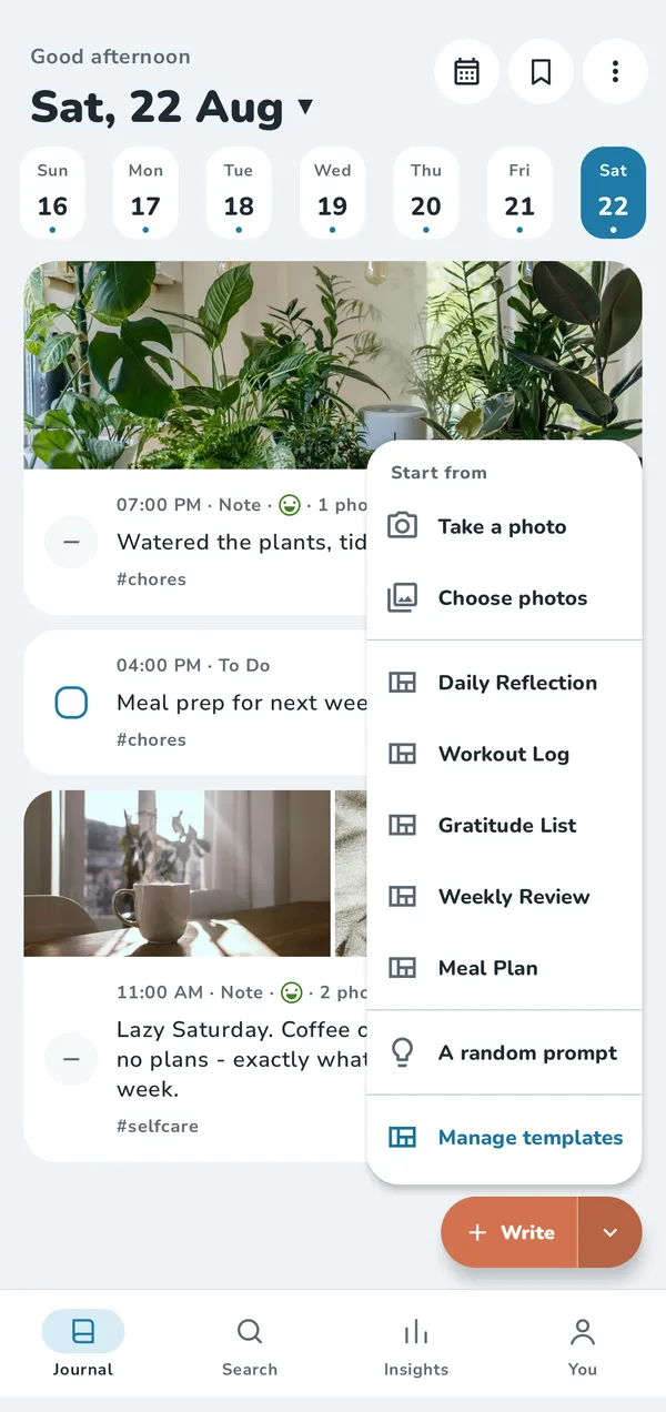 The Journal screen with the Write menu open: take a photo, choose photos, templates and a random prompt